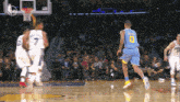 a basketball player wearing a blue jersey with the number 0