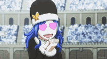 a girl with blue hair and pink heart shaped eyes is wearing a black hat .