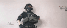 a woman is holding a gun in front of a sign that says ncsmwk.com.au