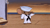 a cartoon mouse dressed as a sailor is standing on a deck .