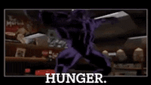 a purple robot is standing in a room with the words `` hunger '' .