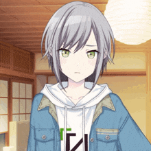 a girl with gray hair and green eyes is wearing a blue jacket and a white shirt with the letter n on it