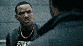 a man wearing a black shirt that says erica