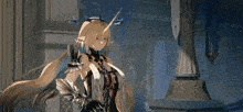 a person is holding a sword in a room with a blue light coming out of the sword .