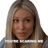 a woman says " you 're scaring me " in front of a white background