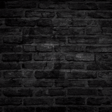 a black brick wall with keithan written in white letters