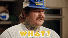 a man wearing a blue hat with the word blue goose on it says what