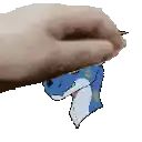 a person 's hand is holding a blue and white dragon 's head .