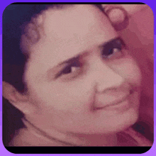 a close up of a woman 's face with a purple border around it