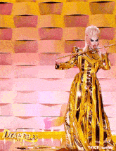 a drag queen is playing a trombone in front of a wall that says drag race all stars