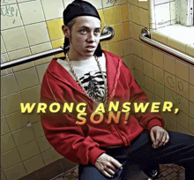 a young man in a red jacket sits in a bathroom with the words wrong answer son written above him