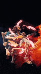 a man sitting in a chair playing a guitar