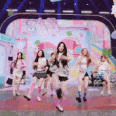 a group of girls are dancing in front of a stage that says style