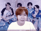 a group of young men are sitting on a bed and one of them is wearing a white t-shirt with the word visions on it