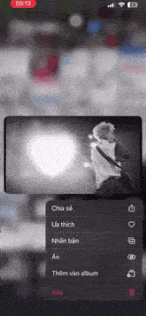 a black and white photo of a man with the time of 00:13 on the bottom