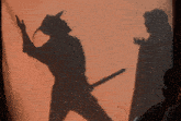 a shadow of a man holding a sword is behind a woman