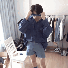 Dressing Up Ultimate Troop GIF - Dressing Up Ultimate Troop Fitting GIFs