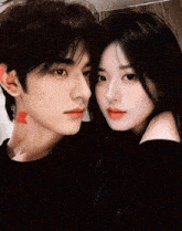a woman with red lipstick on her lips kisses a man with a tattoo on his neck