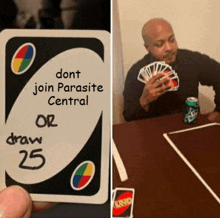 a card that says dont join parasite central is next to a man playing uno