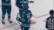 a hockey player wearing the number 71 jersey