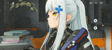 a girl with a blue flower in her hair is sitting in a room