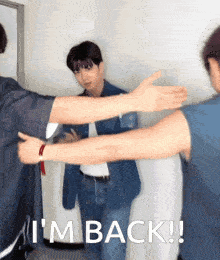 two men hugging each other with the words i 'm back