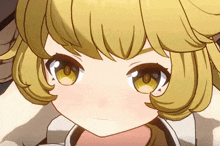 a close up of a little girl 's face with yellow hair