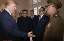 trump trump and kim singapore handshake salute