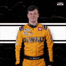 a man wearing a yellow and black dewalt racing suit