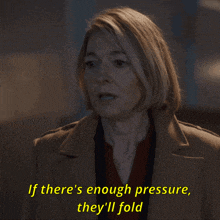 a woman in a tan coat says " if there 's enough pressure they 'll fold "
