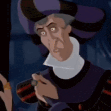 a cartoon character is wearing a purple hat and holding a green ring .