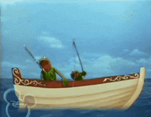 kermit the frog is fishing in a boat with a disney logo on the side