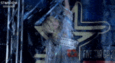 a woman stands in front of a sign that says five star gp 20