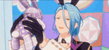 a man with blue hair is holding a stuffed bunny rabbit .