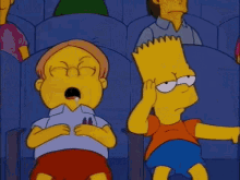 bart simpson is sitting in a theatre with a group of people .