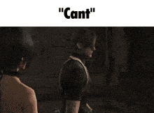 a man and a woman are standing next to each other and the woman is saying " can 't " .