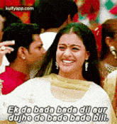 a woman is smiling in front of a crowd of people and a man .