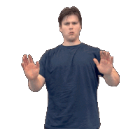 a man wearing a blue shirt is making a stop sign