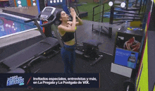 a woman is standing on a treadmill in front of a sign that says universal reality