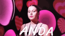 a woman is surrounded by pink hearts and the words anda