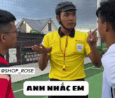 a man wearing a yellow shirt that says fifa