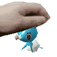 a hand is holding a small blue cartoon character on top of it .