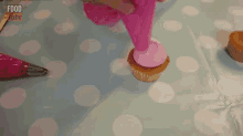 Piping A Cupcake GIF - Cupcake Frosting Pink GIFs