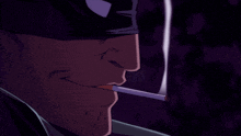 a man smoking a cigarette in a dark room