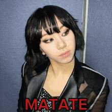 a picture of a woman with the word matate written in red