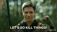 a man is holding a shotgun and saying `` let 's go kill things '' .