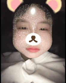 a girl wearing a teddy bear mask on her face