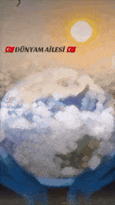 a painting of the earth with the words dünyam ailesi on the top