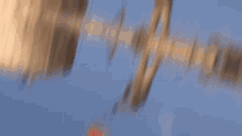 a blurred image of a person standing next to a can of soda