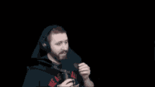 a man wearing headphones and a shirt that says we are jake on it